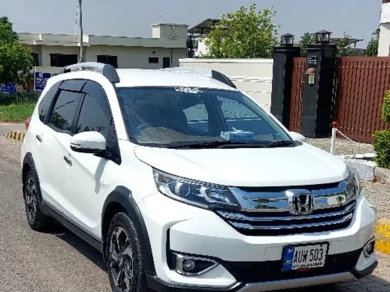 A Khan Rent a Car vehicle being delivered on the road in Lahore A Khan Rent a Car vehicle being delivered on the road in Lahore
